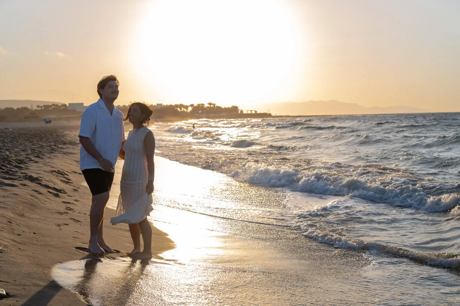 couple walking in aposelemis beach just before proposal