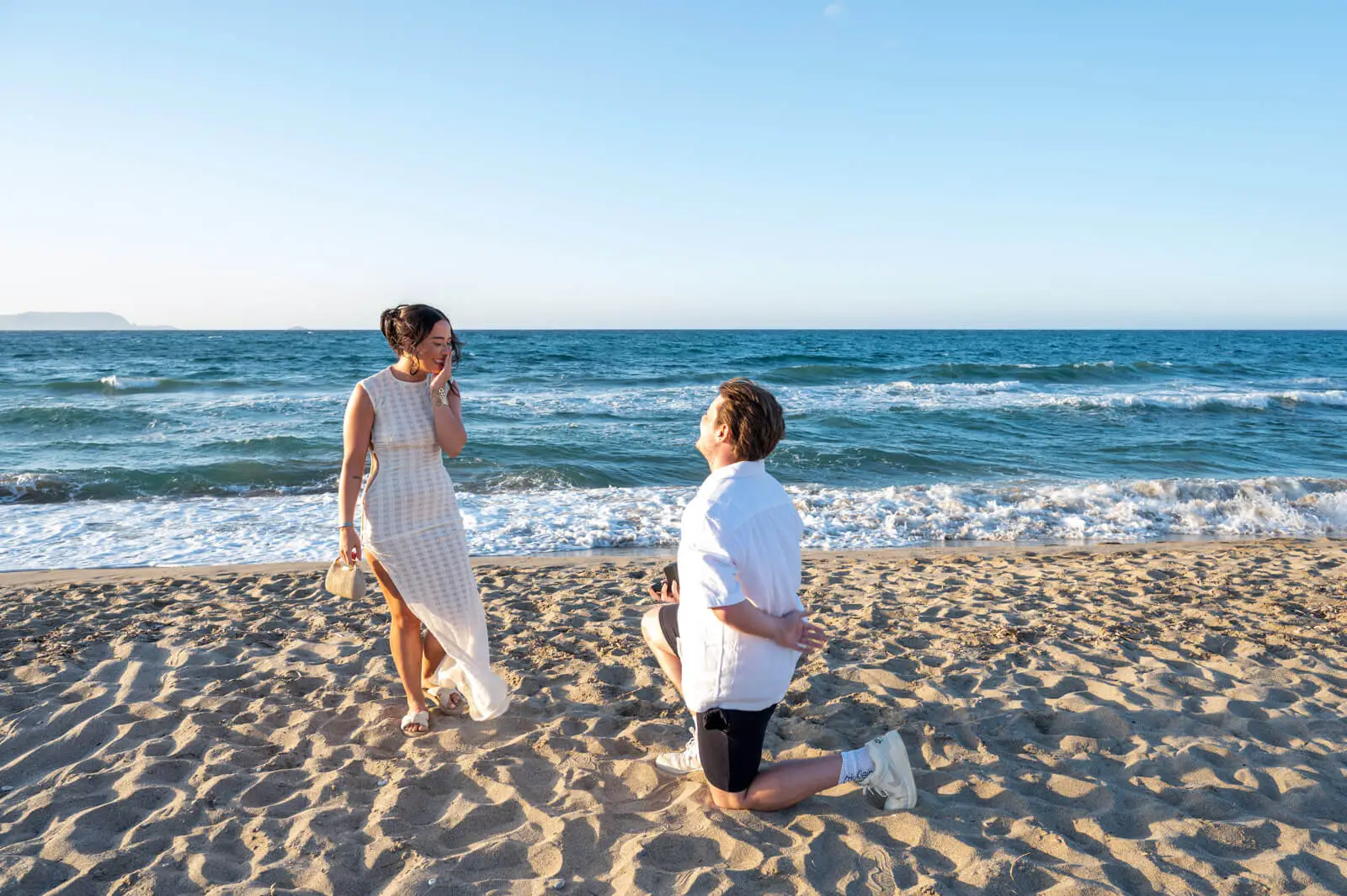 A romantic beach setup for a surprise proposal in Crete with a step-by-step guide theme