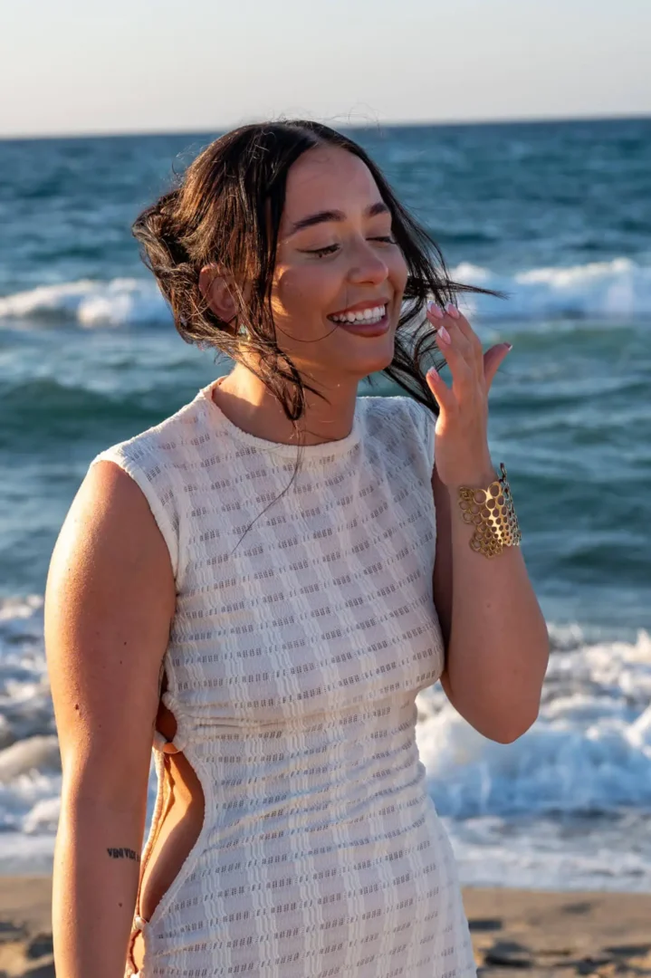 A lady getting emotional during a surprise marriage proposal on Aposelemis beach in Crete