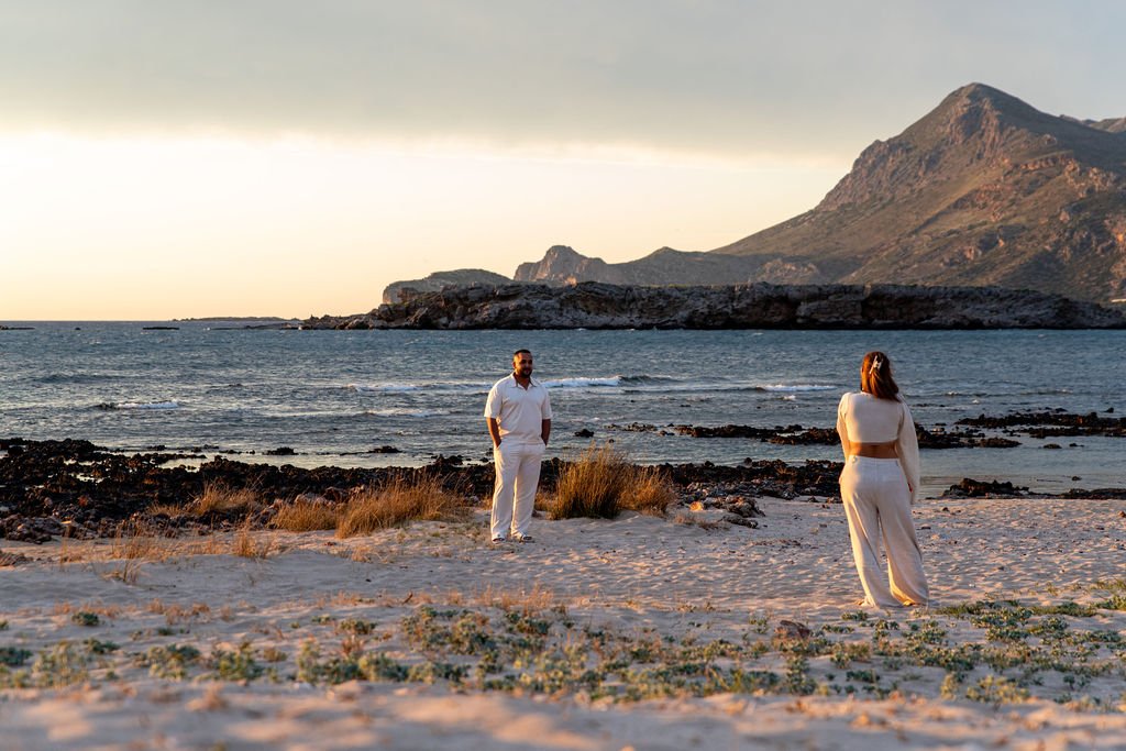 Sunset marriage proposal at Falassarna Beach in Crete with discreet photography and a natural seaside setting.